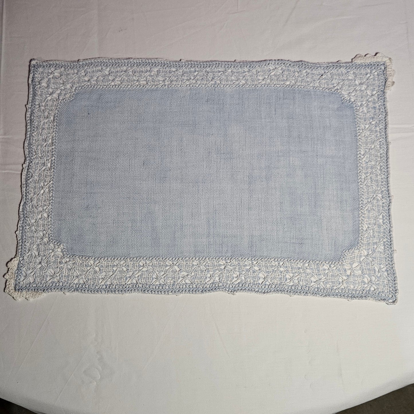 Vintage placemats, light blue linen with threadwork border and crochet accents, set of 7