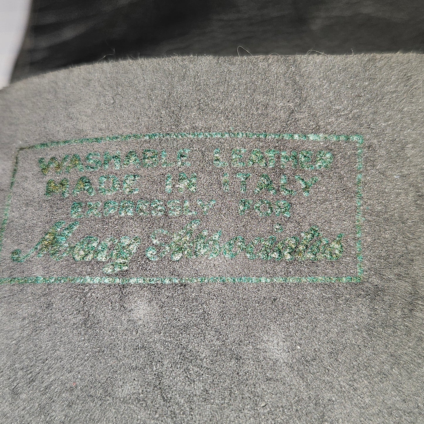 Vintage women's long grey leather unlined gloves. Made in Italy for Macy Associates.