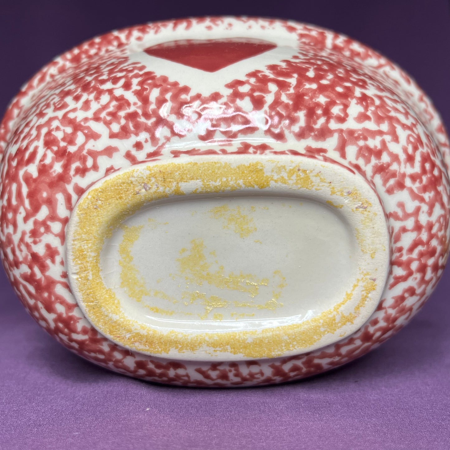 Vintage red spongeware steamer dish with heart motif