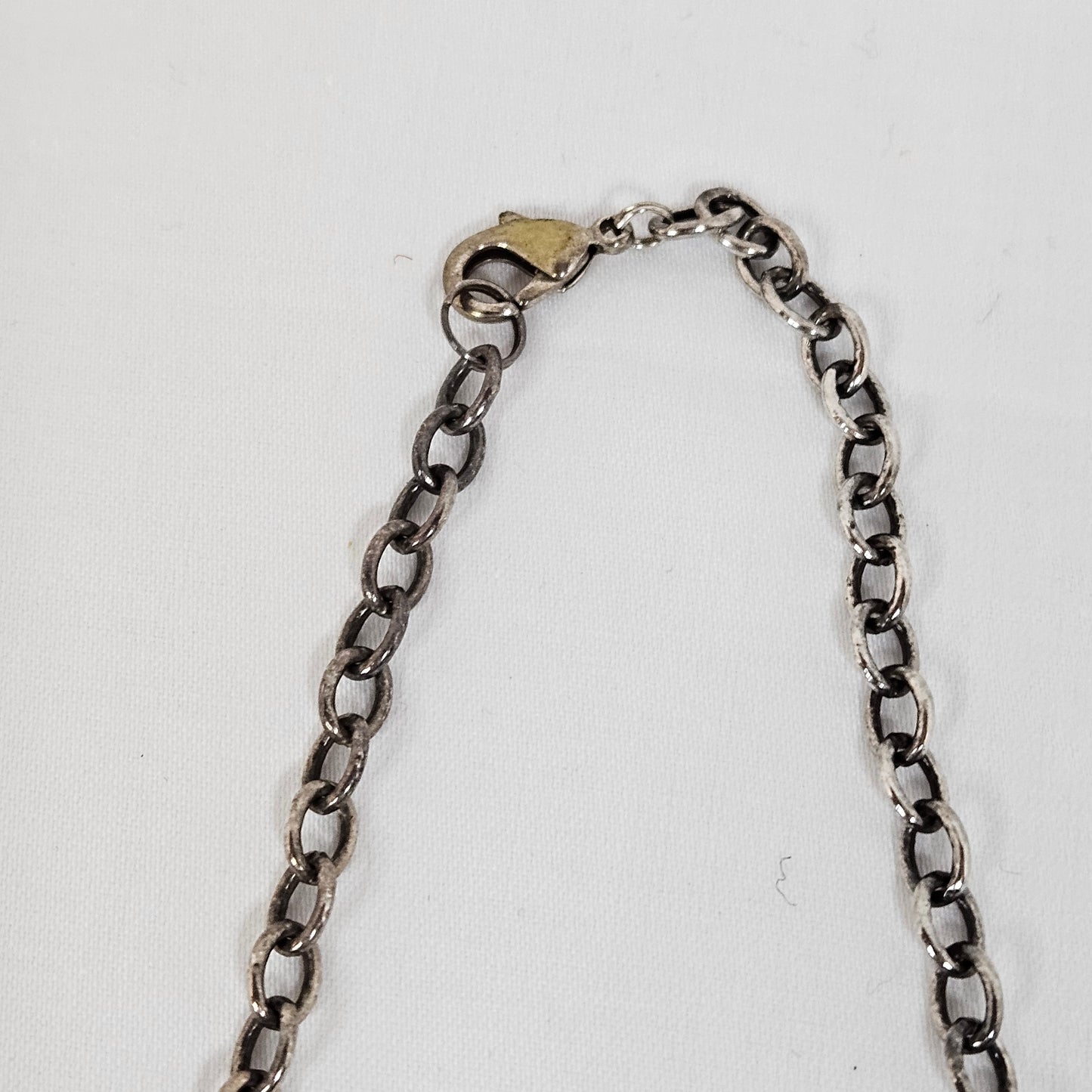 Asymmetric long necklace with mother of pearl beads and silver hoops and chain