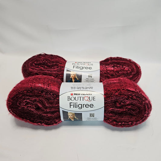 Red Heart Filigree super bulky yarn, color Jubilee 2 skeins