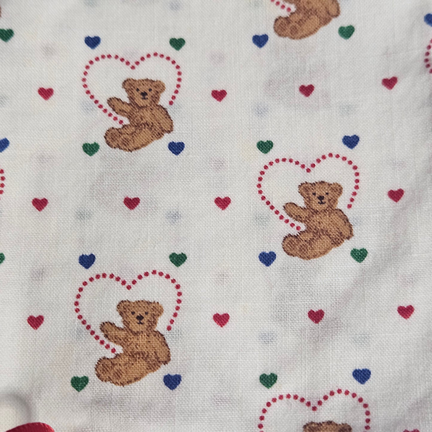 Handmade cotton bib,  teddy bear with hearts, ruffle trim and ribbon accent