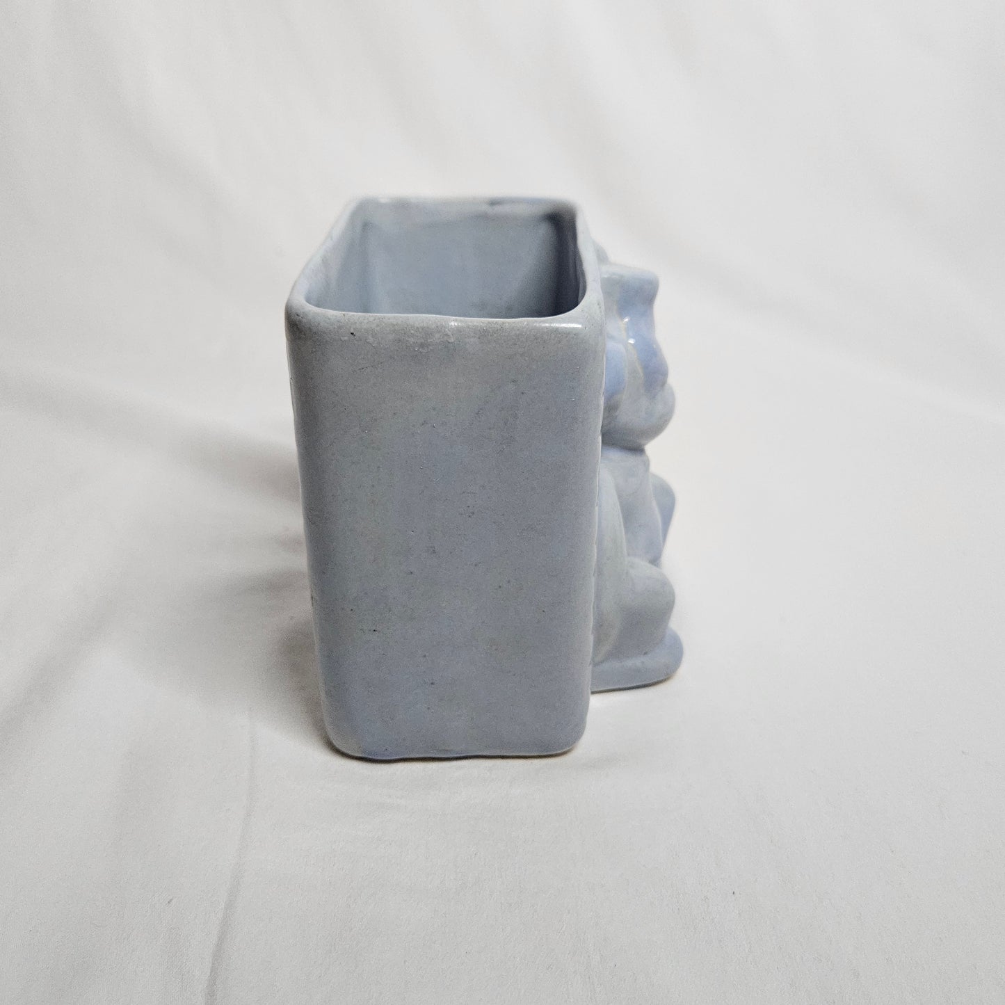Vintage Niloak Circus Monkey planter, light blue, 4" tall