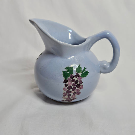 Vintage Niloak Pottery small light blue pitcher with hand-painted grape clusters