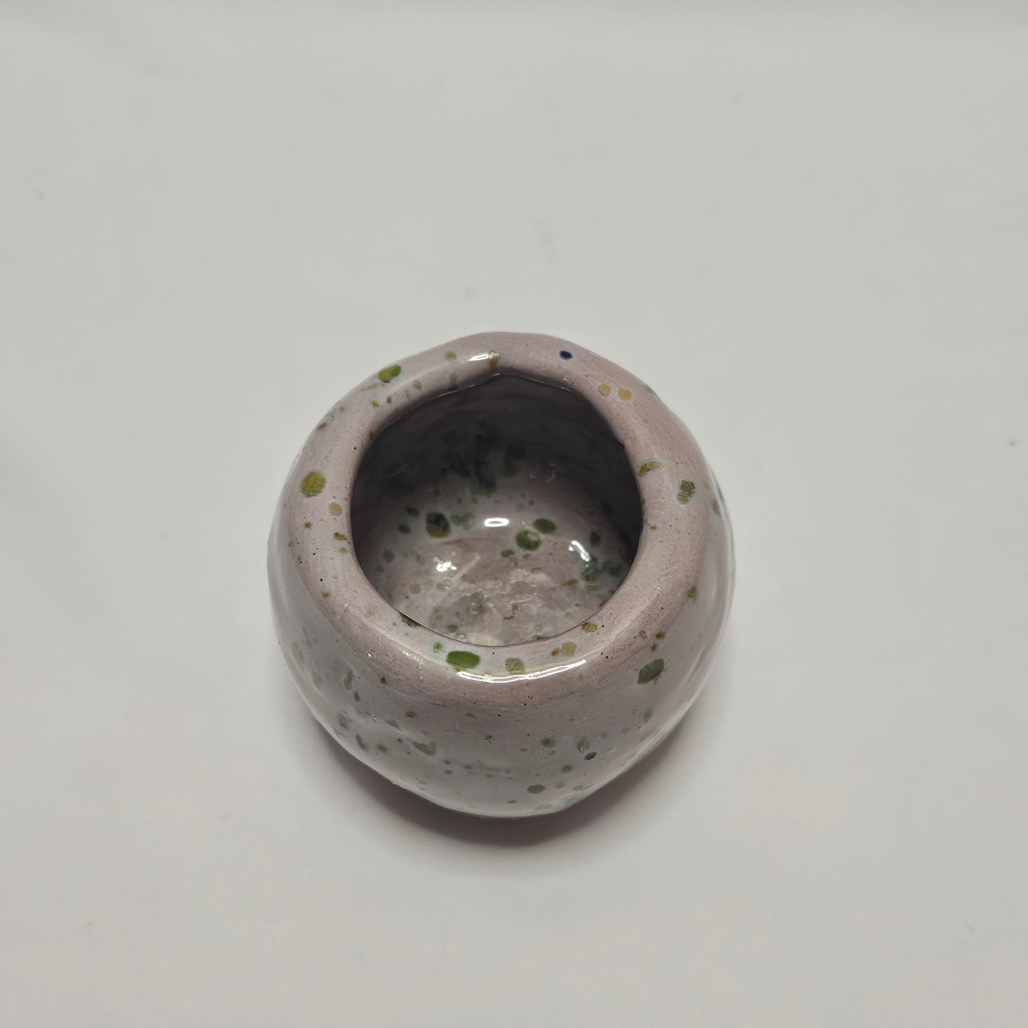 Handmade small primitive bowl, Pink and Green glaze, signed M.R.