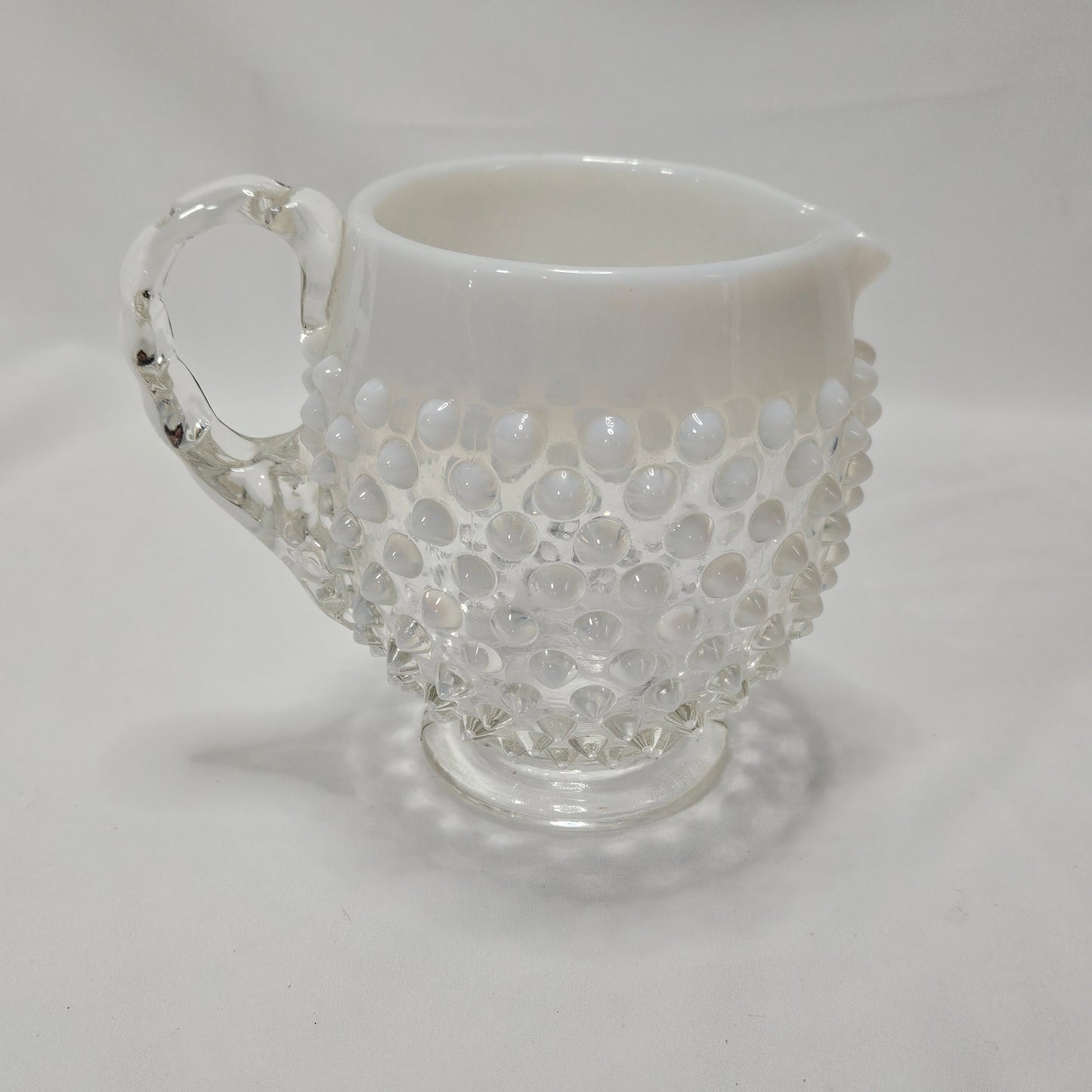 Fenton Opalescent White Hobnail small glass footed pitcher, 4.5" tall, 5.5" wide