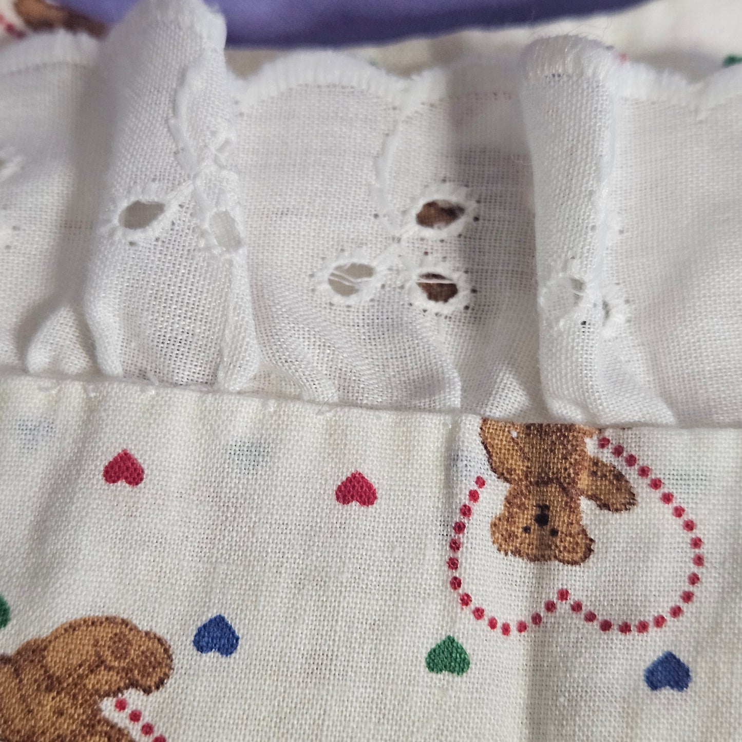 Handmade cotton bib,  teddy bear with hearts, ruffle trim and ribbon accent