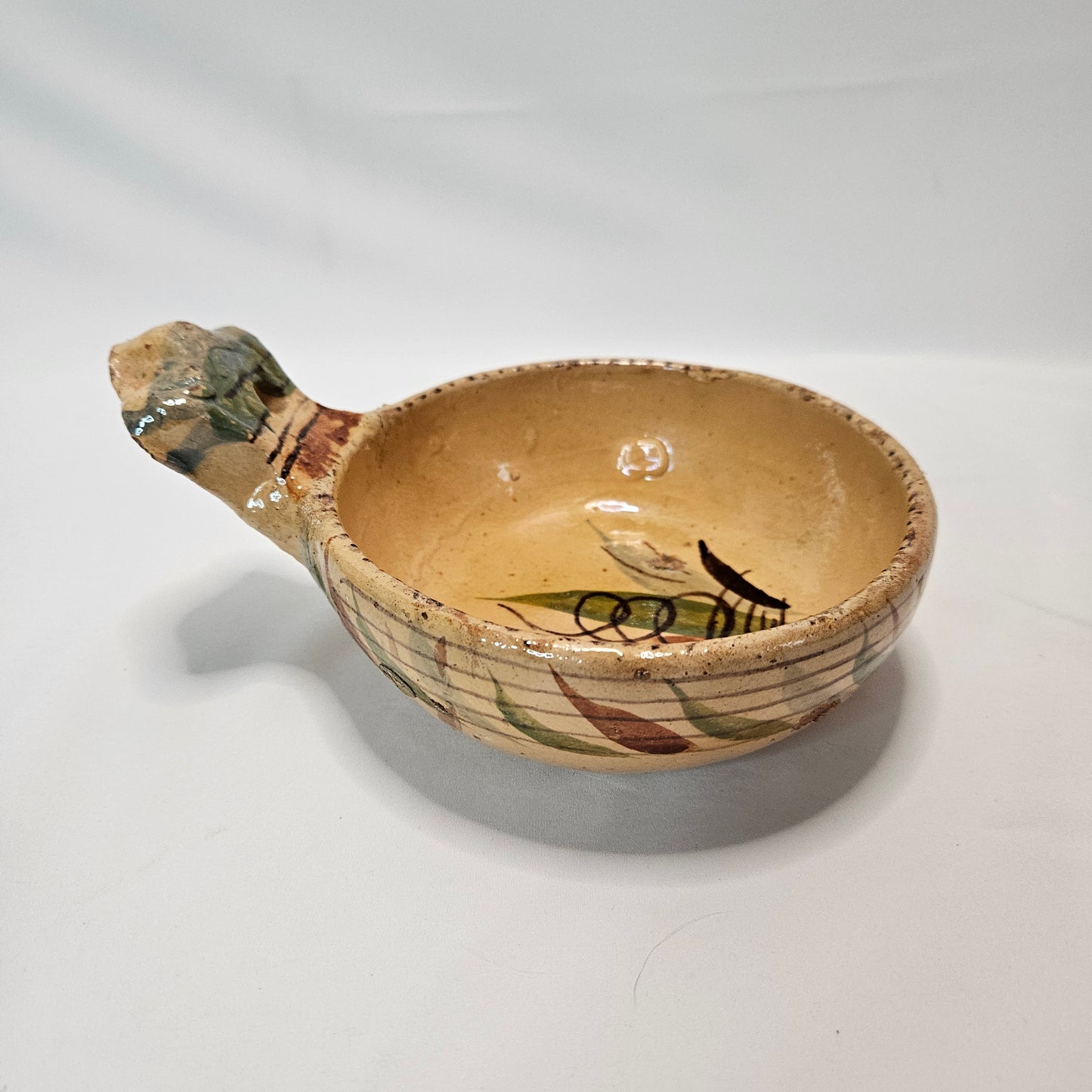 Vintage Mexican primitive clay bowl with handle