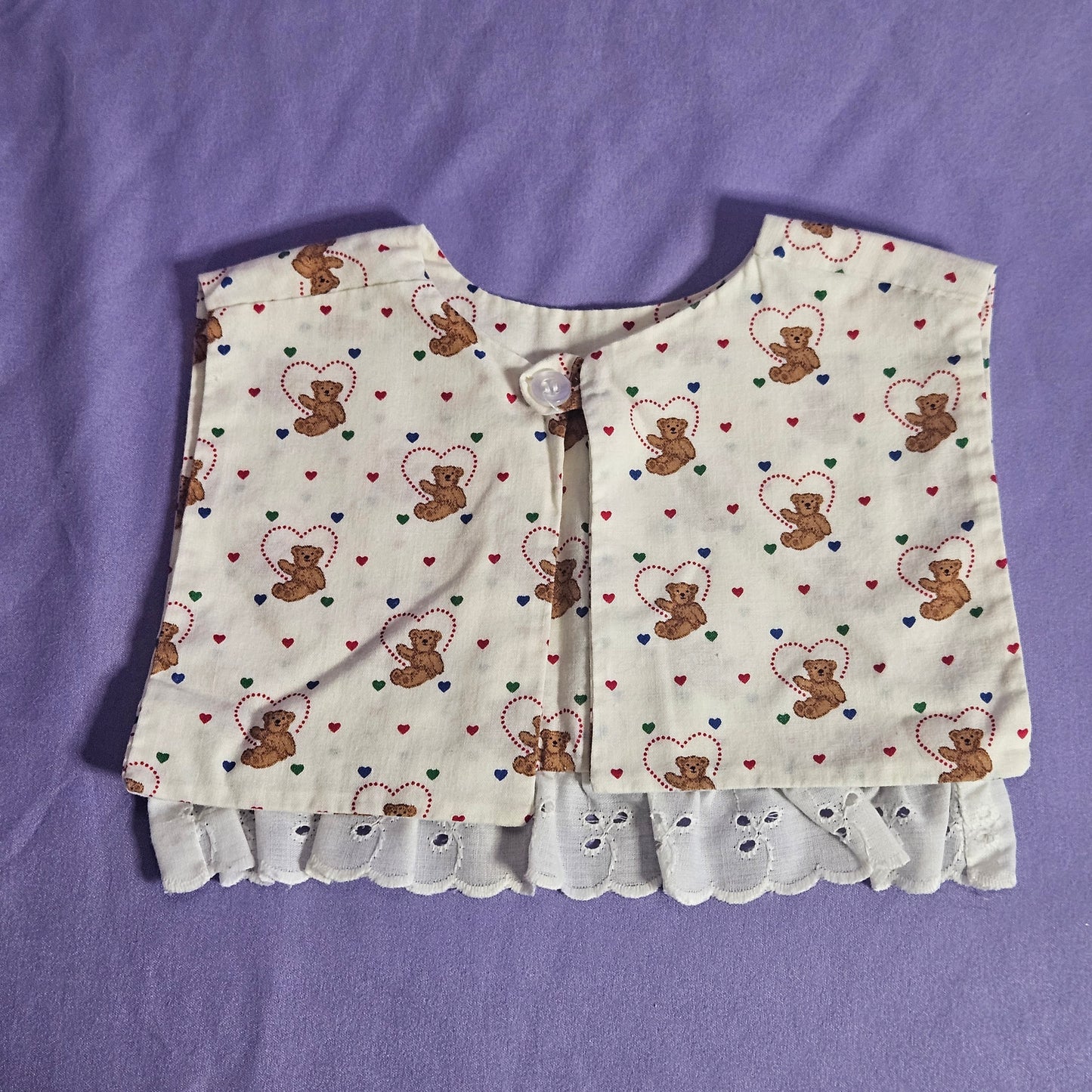 Handmade cotton bib,  teddy bear with hearts, ruffle trim and ribbon accent