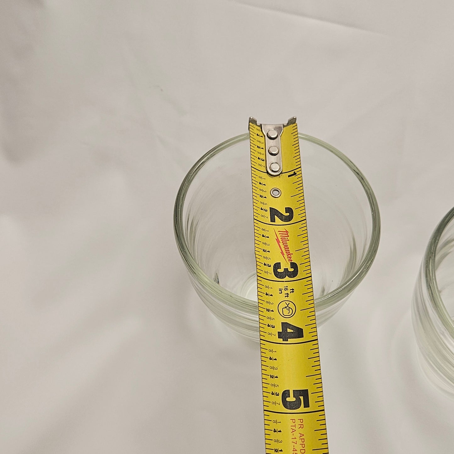 Art glass heavy tumblers, two 4" glasses, hand-blown and engraved "Land"