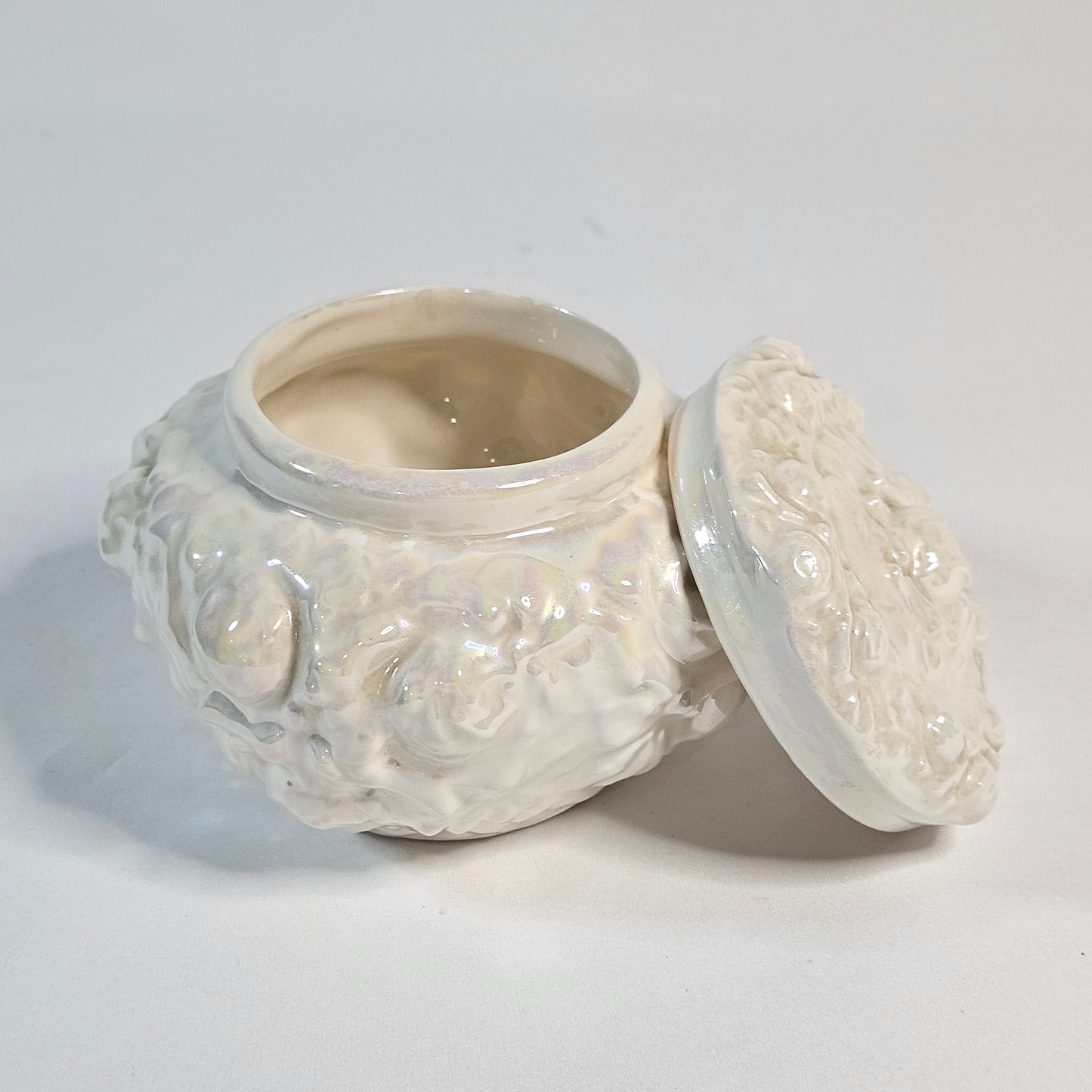 Vintage porcelain trinket box, iridescent white, rose pattern