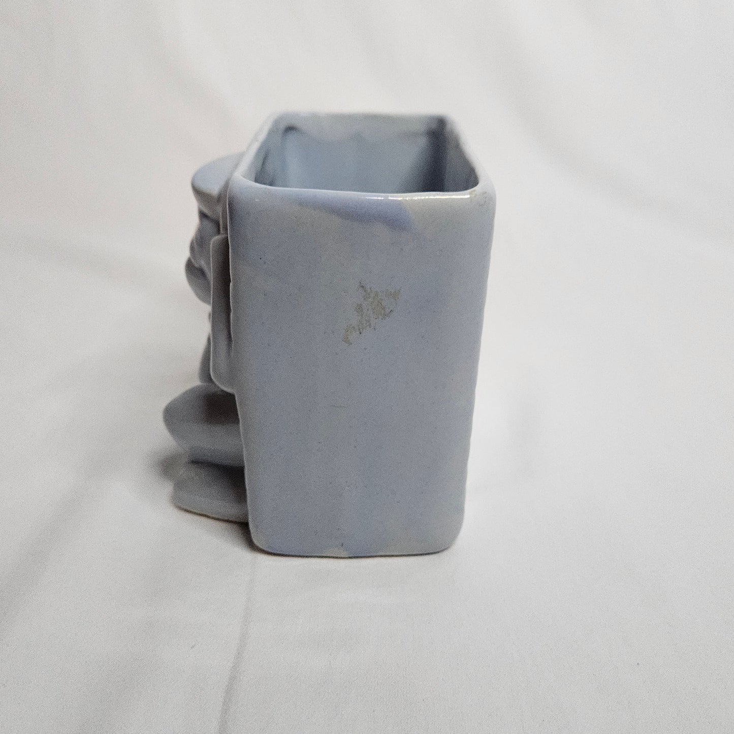 Vintage Niloak Circus Monkey planter, light blue, 4" tall