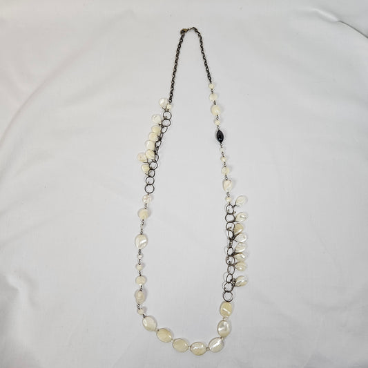 Asymmetric long necklace with mother of pearl beads and silver hoops and chain