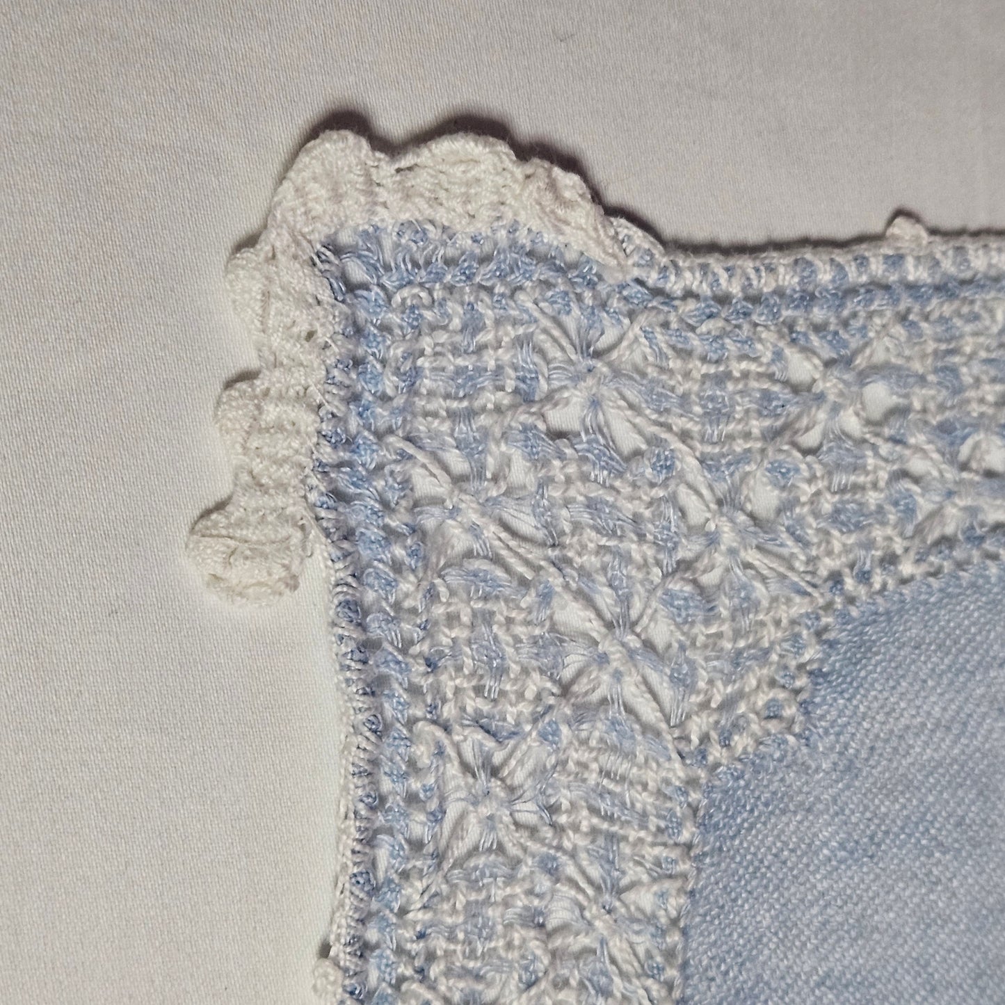 Vintage placemats, light blue linen with threadwork border and crochet accents, set of 7
