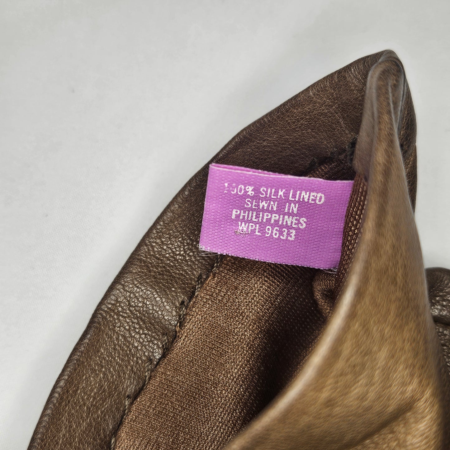 Vintage women's brown leather gloves by Grandoe, size 6.5, silk lined