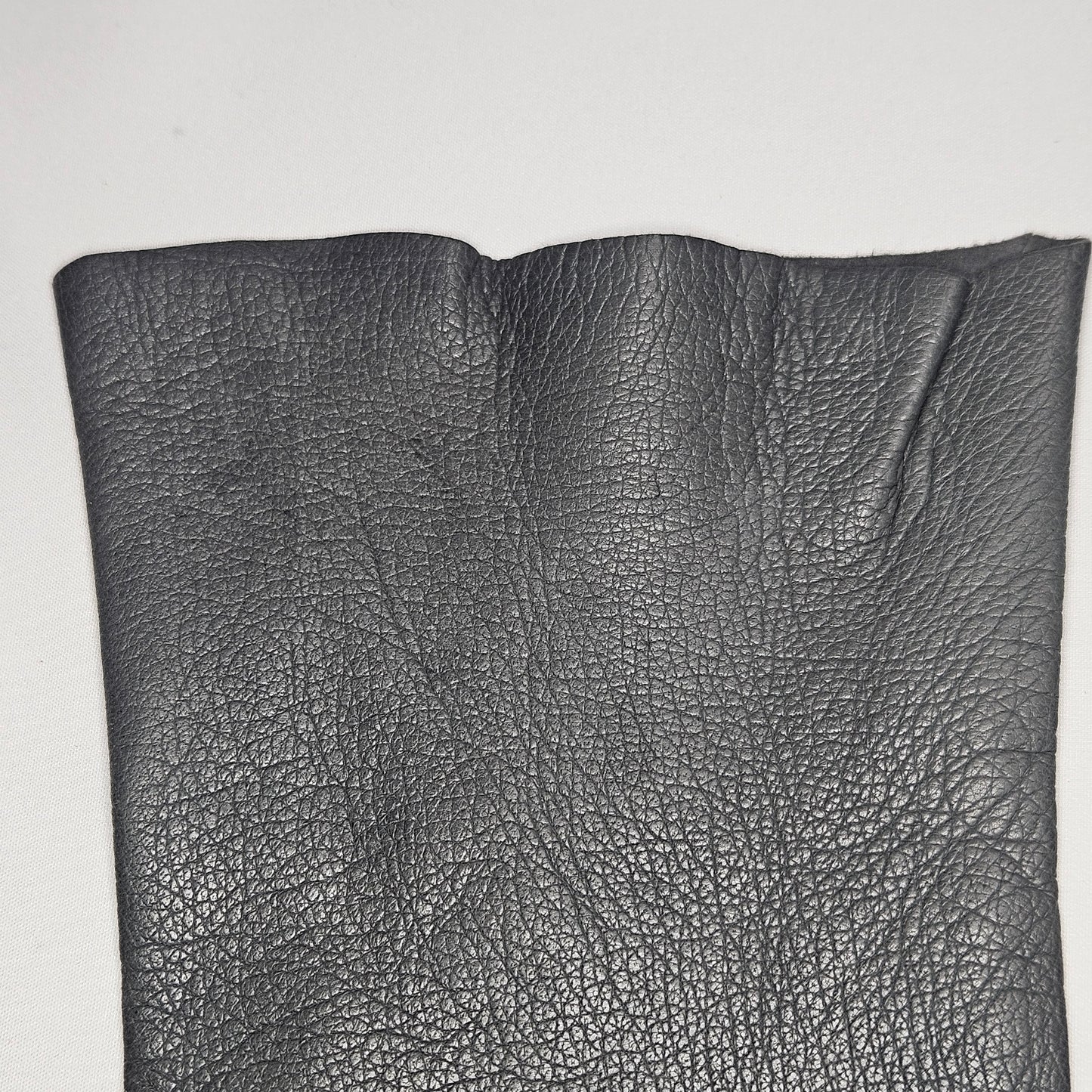Vintage women's long grey leather unlined gloves. Made in Italy for Macy Associates.