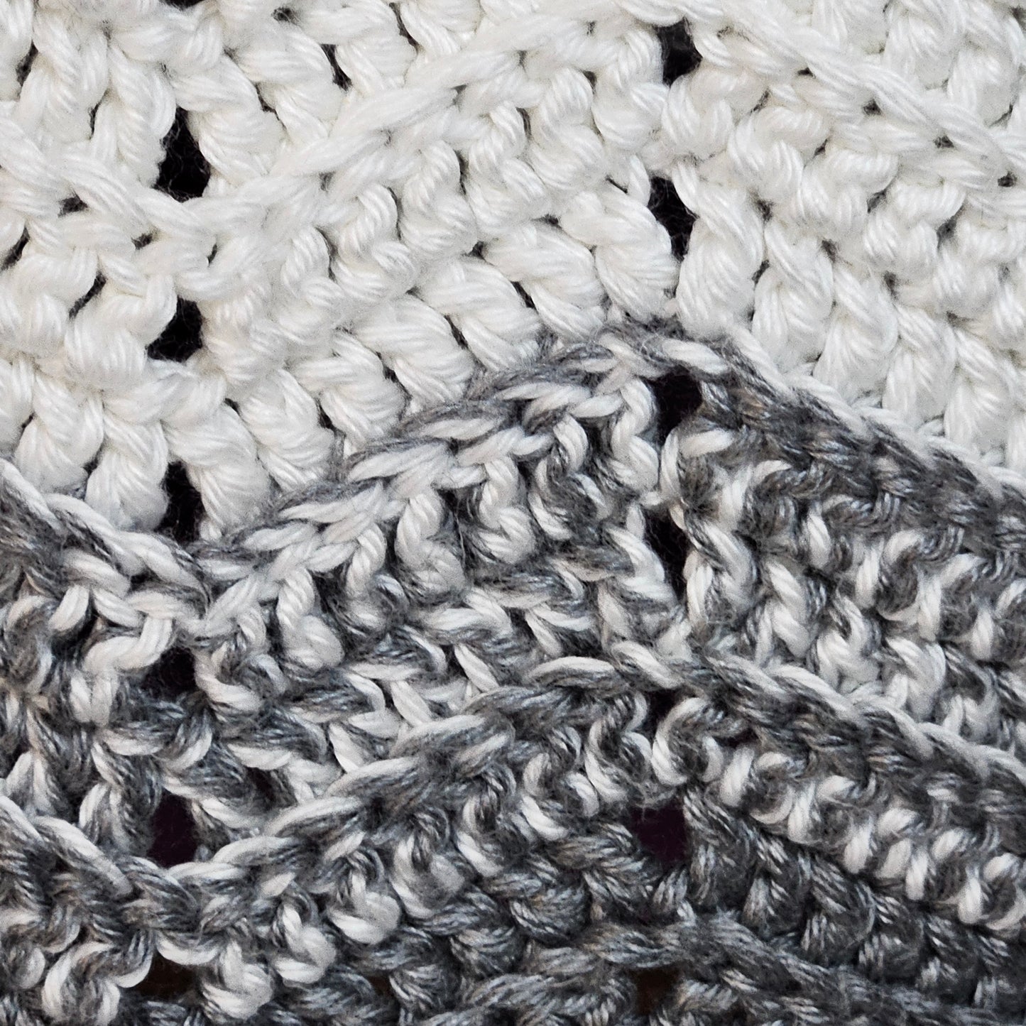 Handmade crochet heavy blanket in black, white, and grey, 45" x 39"