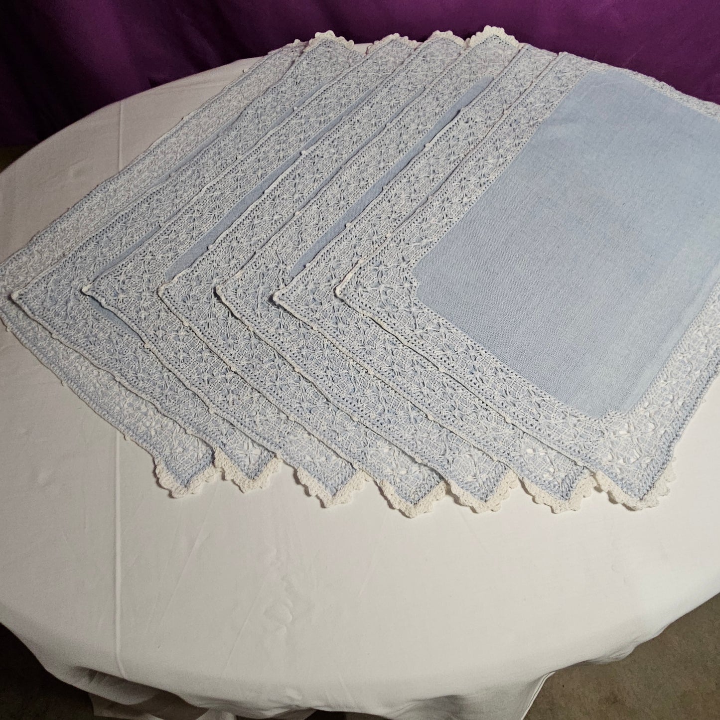 Vintage placemats, light blue linen with threadwork border and crochet accents, set of 7