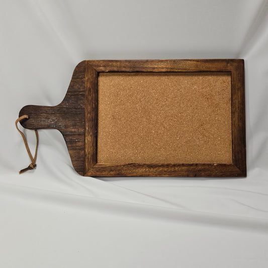 Primitive wooden corkboard with leather hanging strap, 17.25 x 9 "
