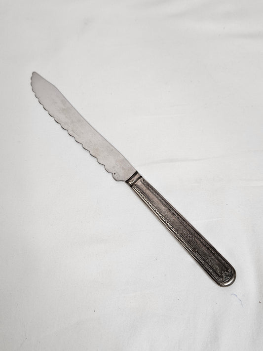 Vintage WM A Rogers serrated cake knife with an S monogram, 10 inches