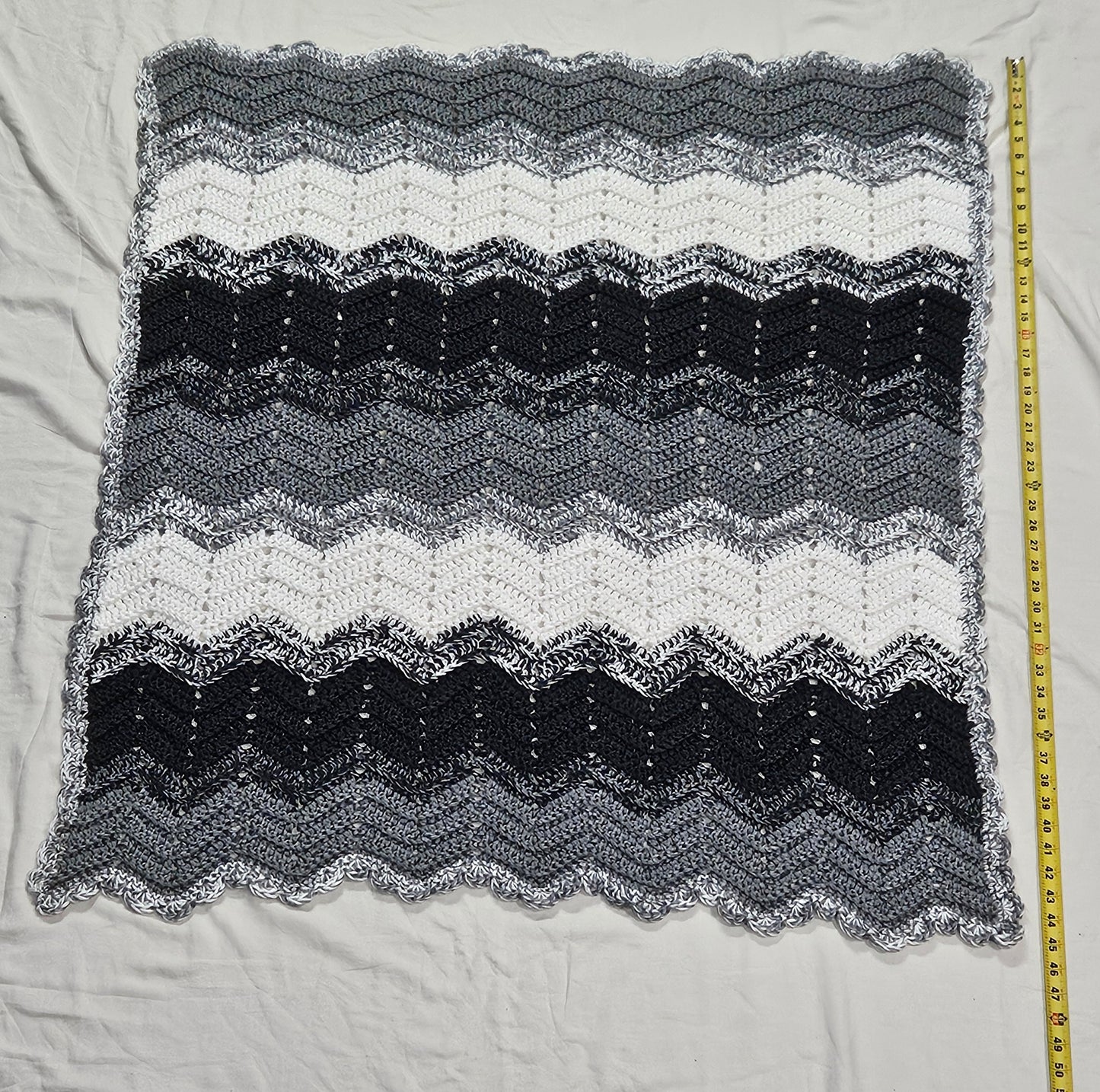Handmade crochet heavy blanket in black, white, and grey, 45" x 39"