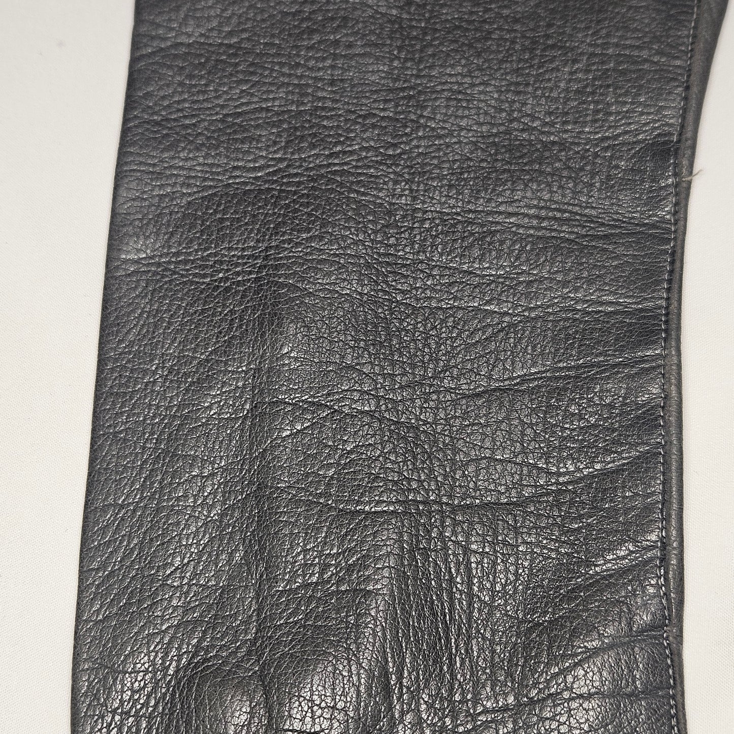 Vintage women's long grey leather unlined gloves. Made in Italy for Macy Associates.