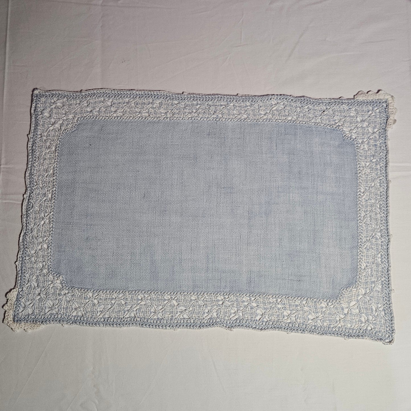 Vintage placemats, light blue linen with threadwork border and crochet accents, set of 7