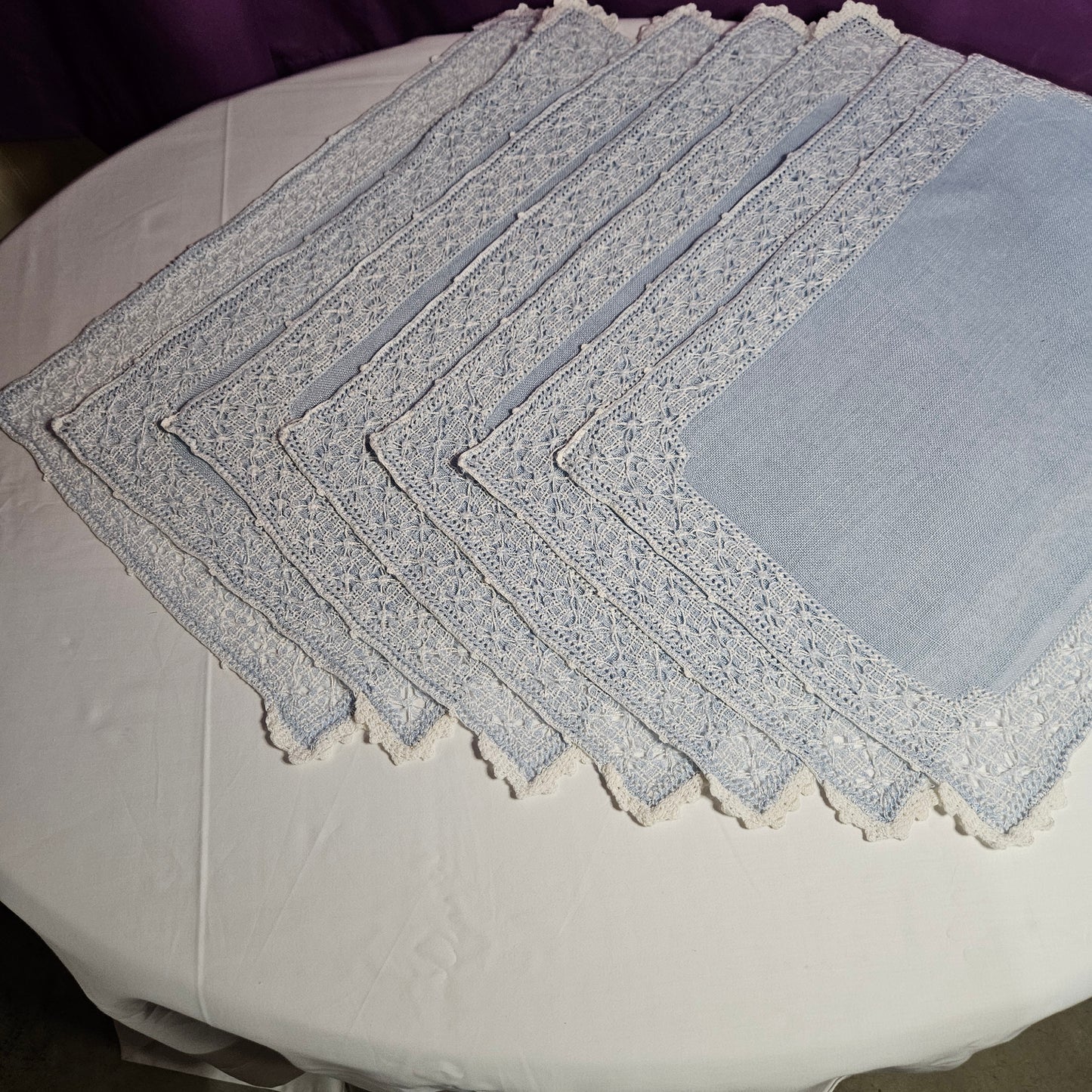 Vintage placemats, light blue linen with threadwork border and crochet accents, set of 7