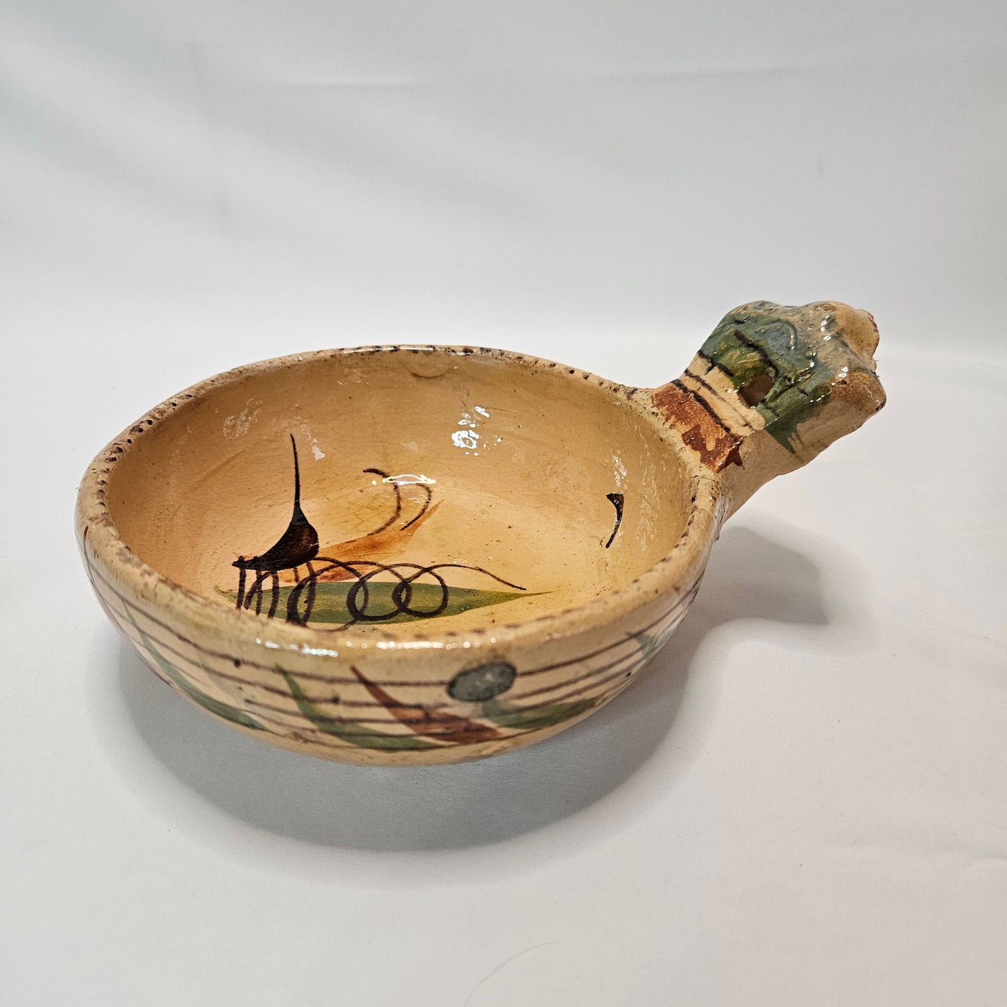 Vintage Mexican primitive clay bowl with handle