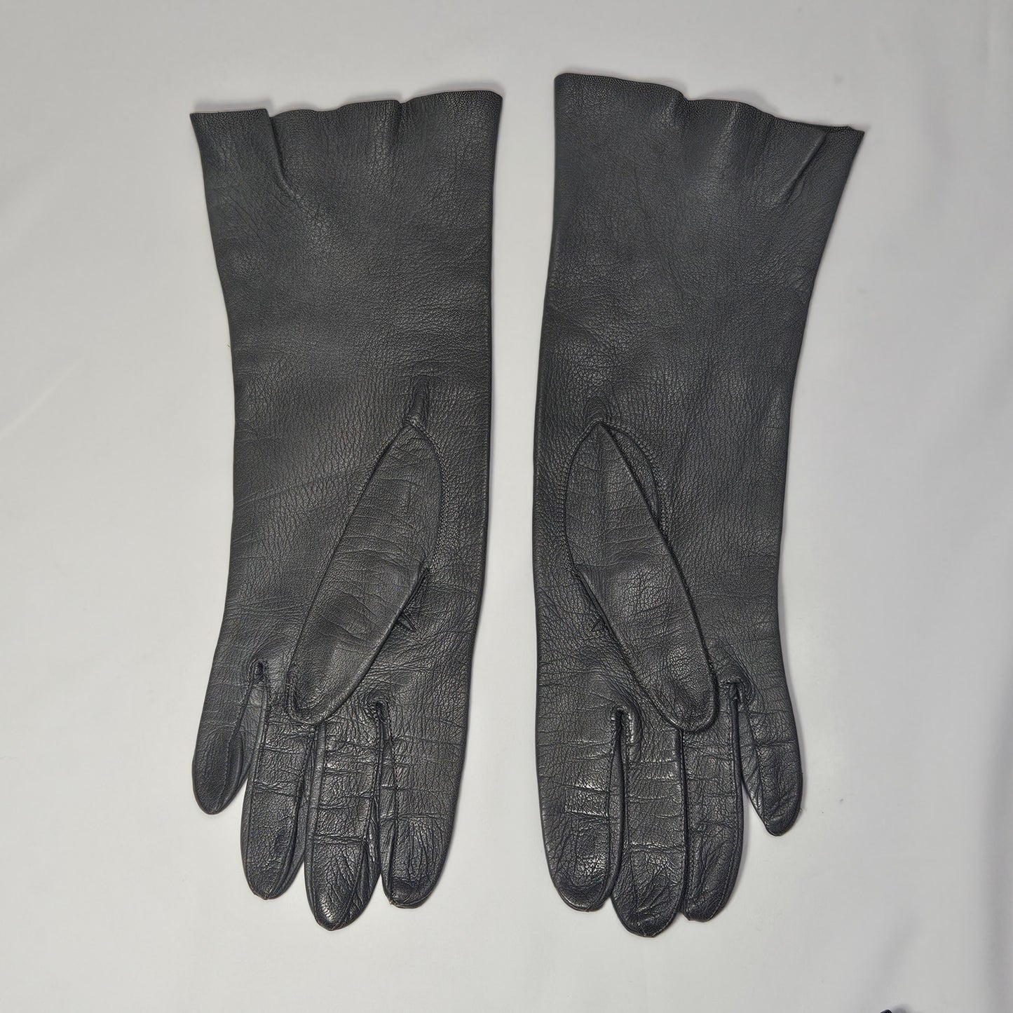 Vintage women's long grey leather unlined gloves. Made in Italy for Macy Associates.