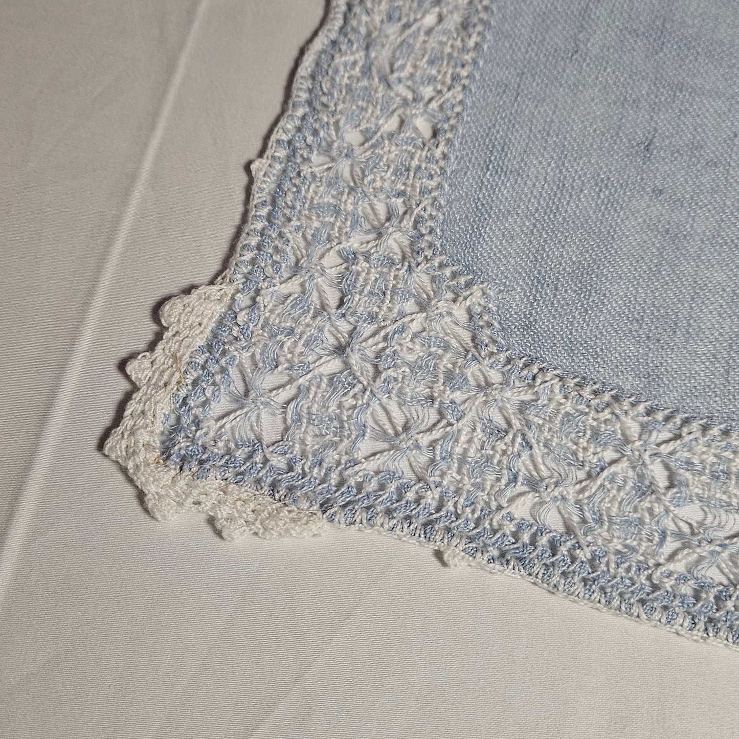 Vintage placemats, light blue linen with threadwork border and crochet accents, set of 7