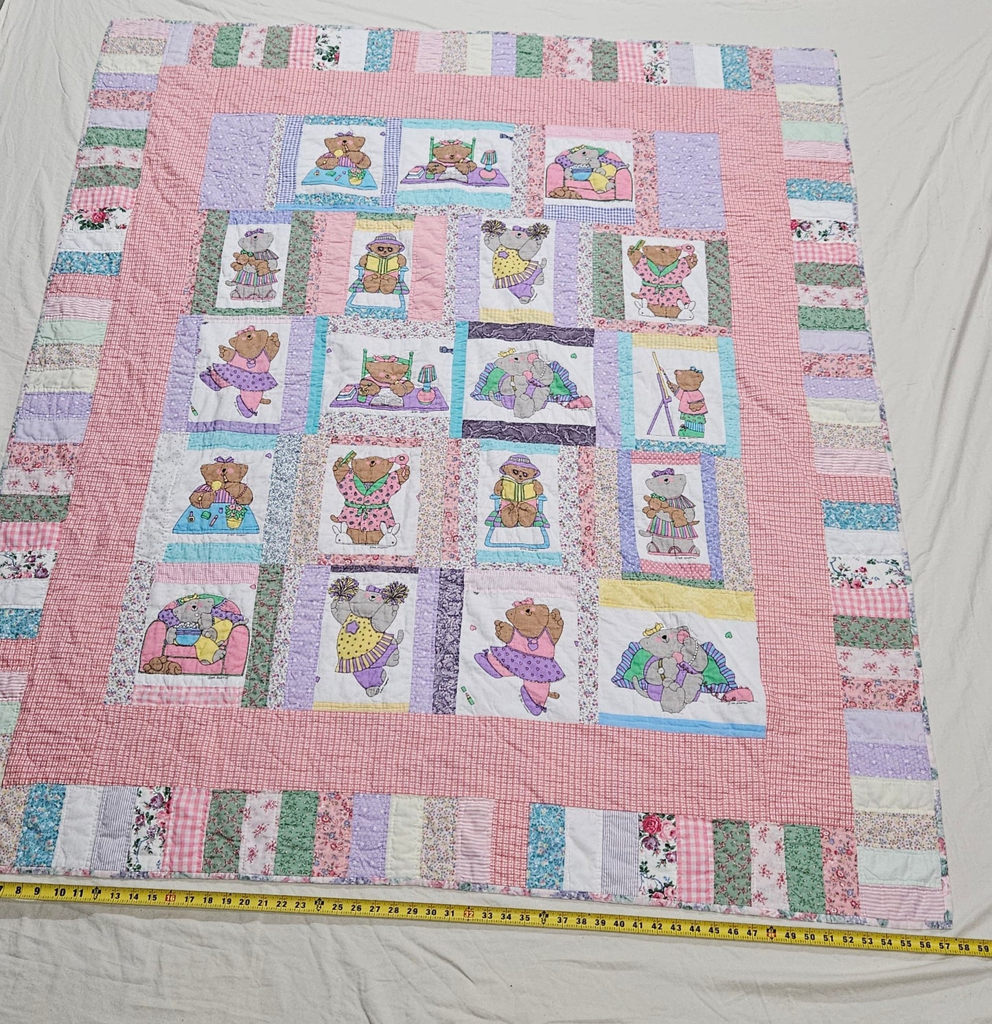 Vintage hand-quilted Sue Dreamer bear quilt, 66 x 58 inches