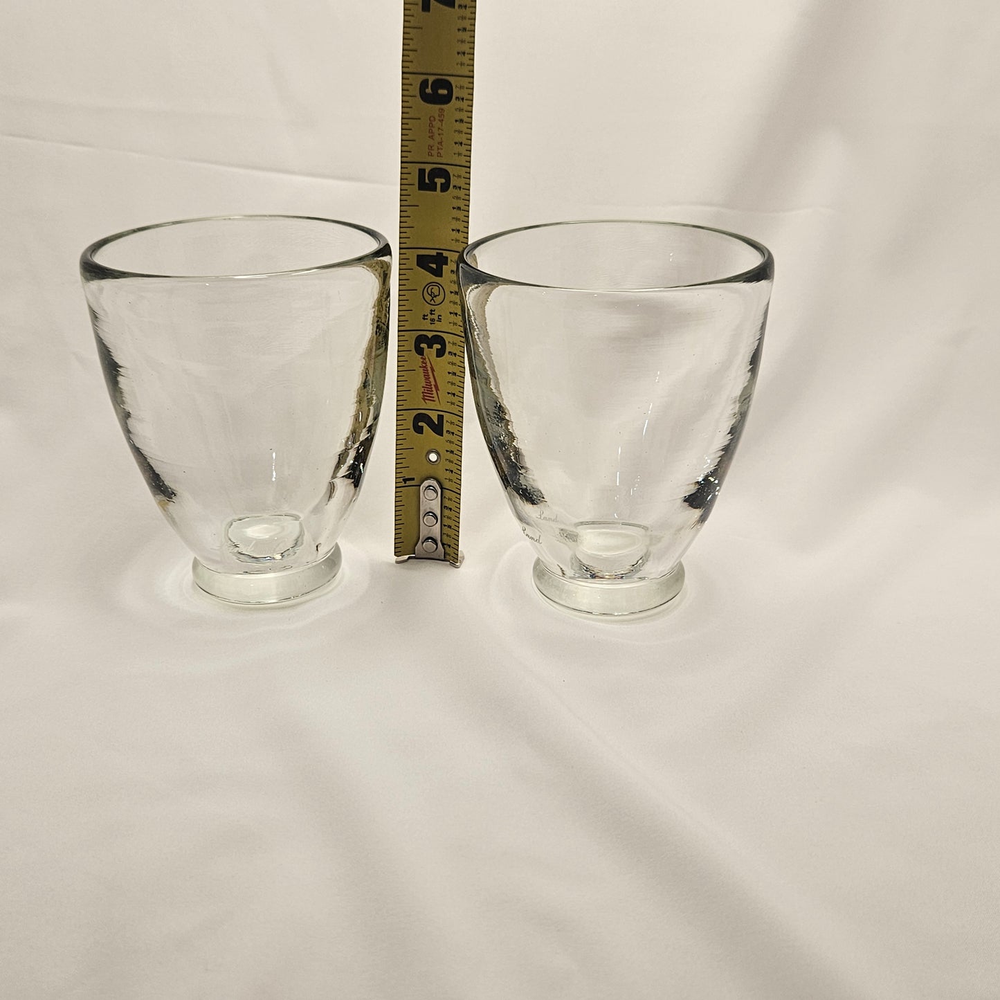 Art glass heavy tumblers, two 4" glasses, hand-blown and engraved "Land"