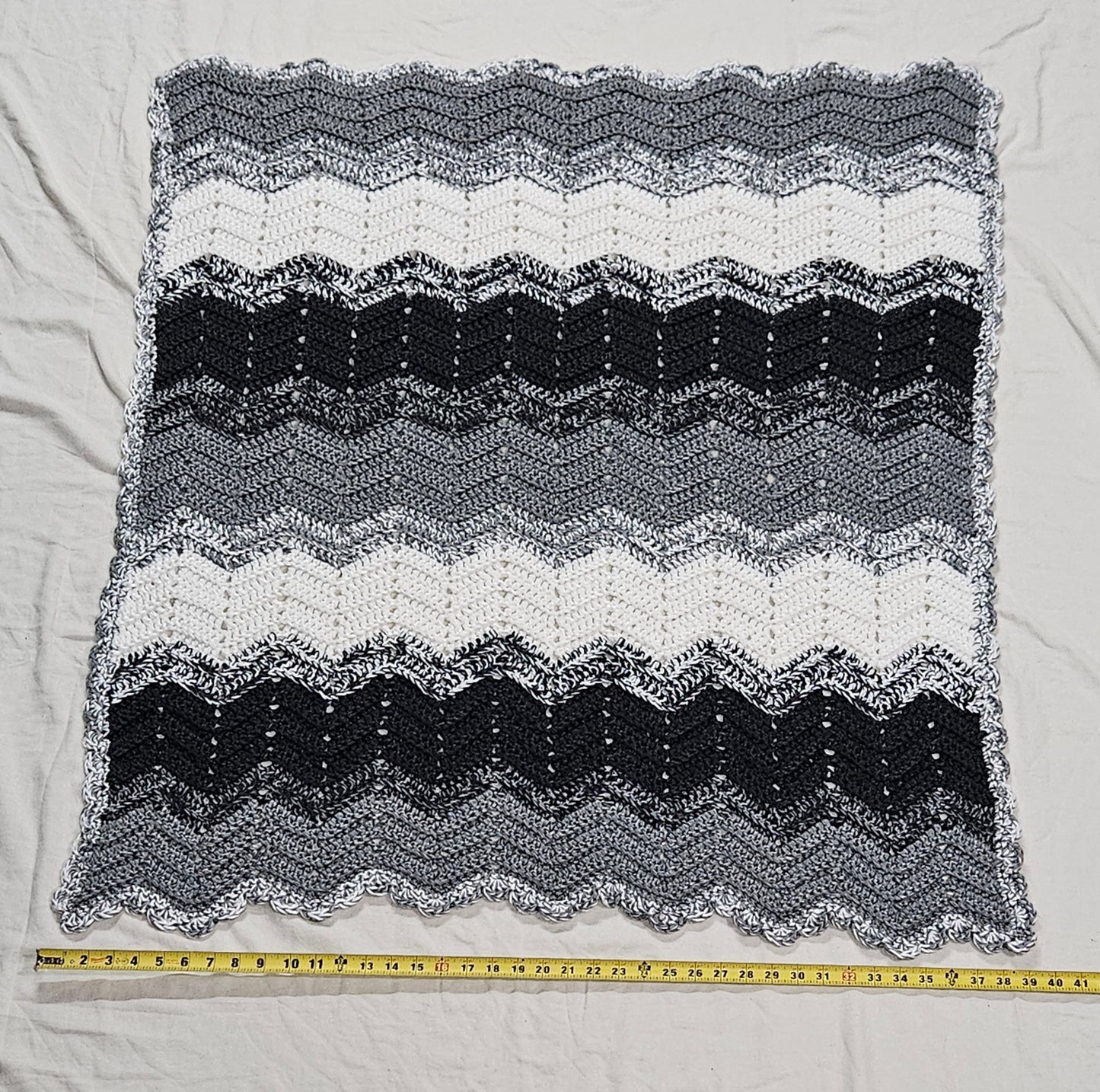 Handmade crochet heavy blanket in black, white, and grey, 45" x 39"