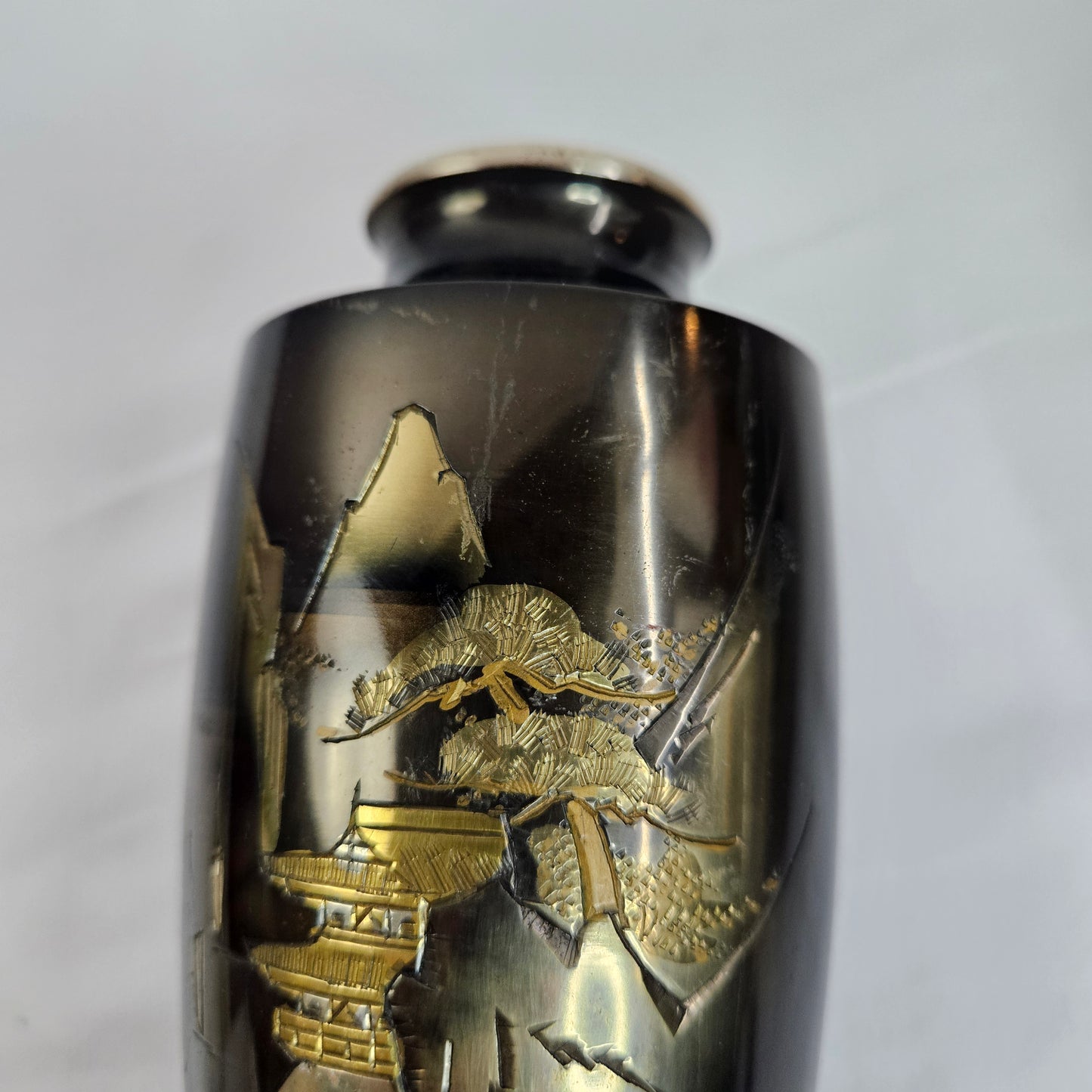 Black enamel vase with Japanese inspired landscape scene and gold accents