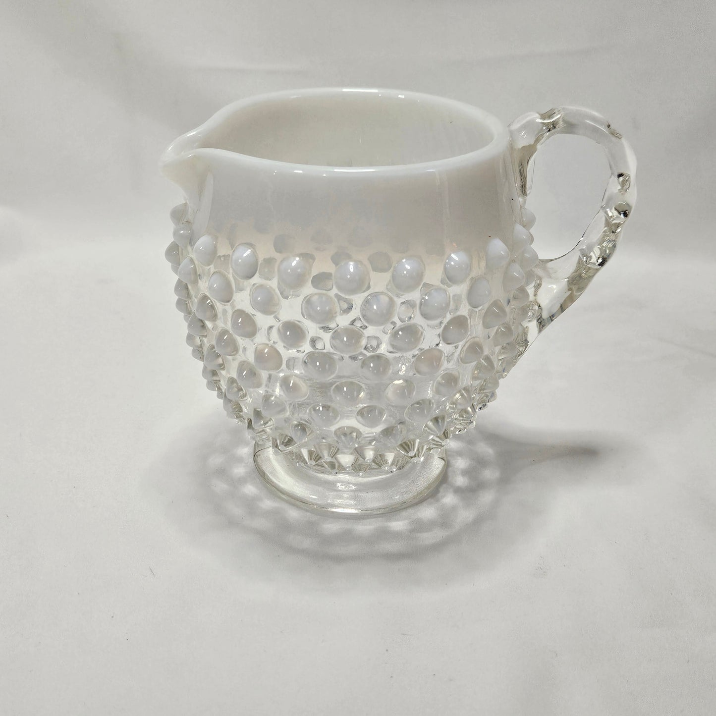 Fenton Opalescent White Hobnail small glass footed pitcher, 4.5" tall, 5.5" wide