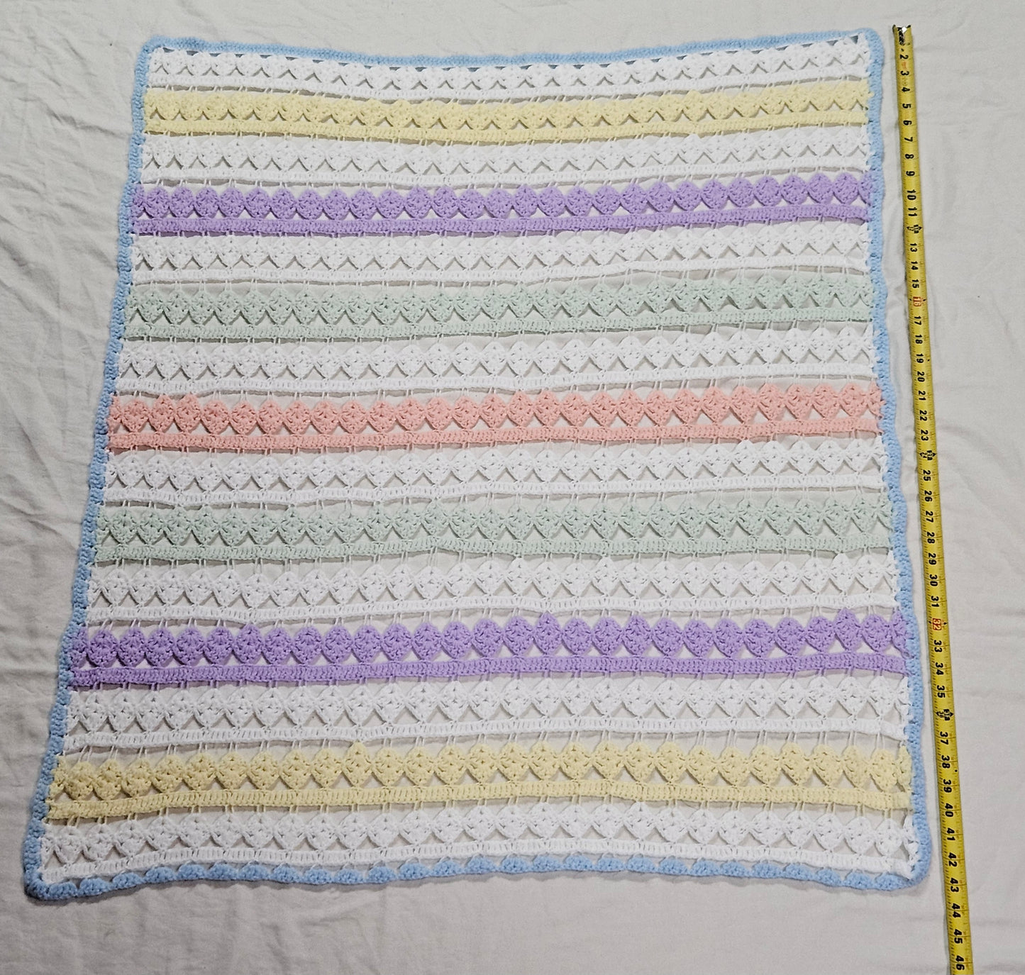 43" x 34" lacy crocheted decorative blanket in pastel colors