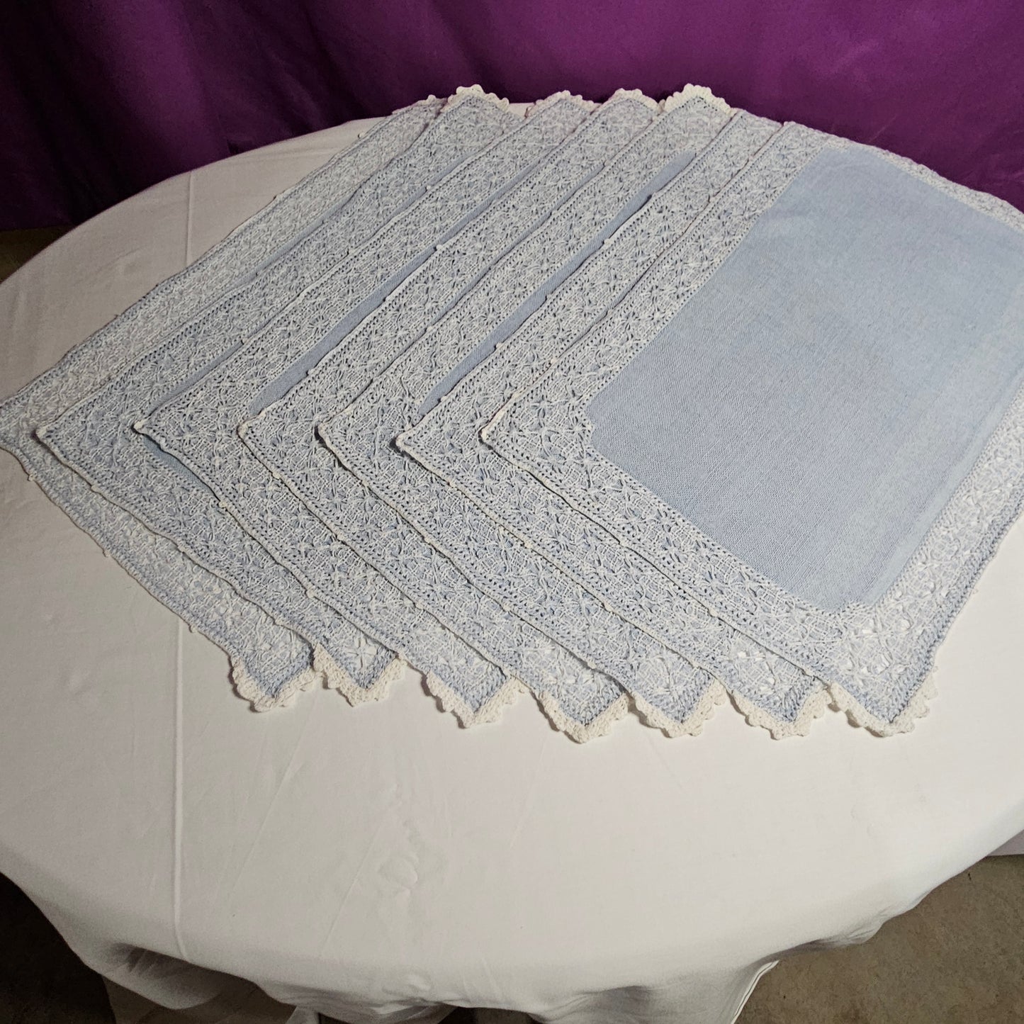 Vintage placemats, light blue linen with threadwork border and crochet accents, set of 7